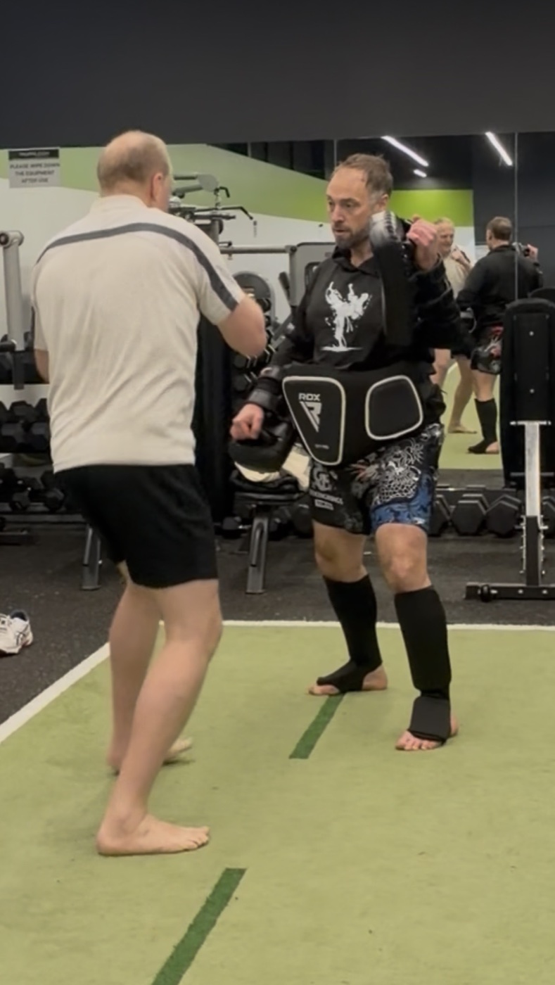 Dave Stennett demonstrating pad training at Thornleigh Squash and Fitness